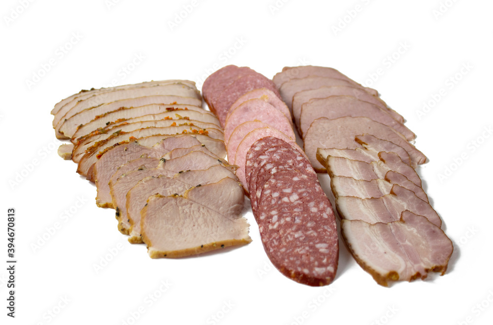Sliced chicken breast, bacon and sausage, baked meat, close-up, isolated on white background