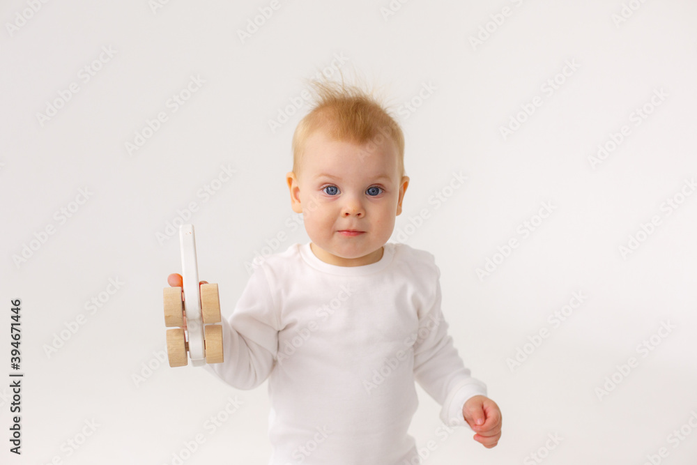 baby playing with a colorful toy isolated on a white background baby playing with a colorful toy isolated on a white background