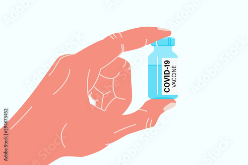 Hand holding antiviral covid 19 vaccine. Covid or coronavirus vaccination