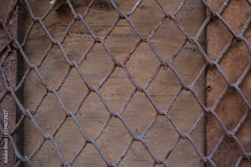 Old Vintage Wood Panel With Iron grid Pattern Horizontal Background. dirty mesh fabric