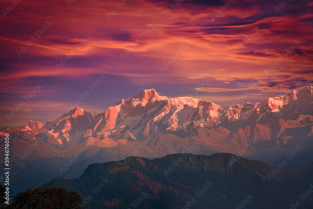 Bright dramatic mountain sunset sky over Kedarnath peak of Gangotri Range in the western Garhwal Himalaya, Uttarakhand, India. View from Chopta village