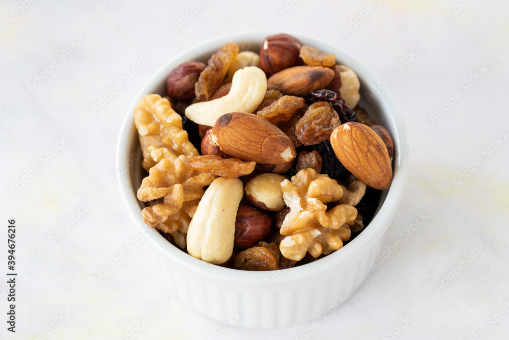 mixed nuts in bowl - on white background mixed nuts in bowl - on white background