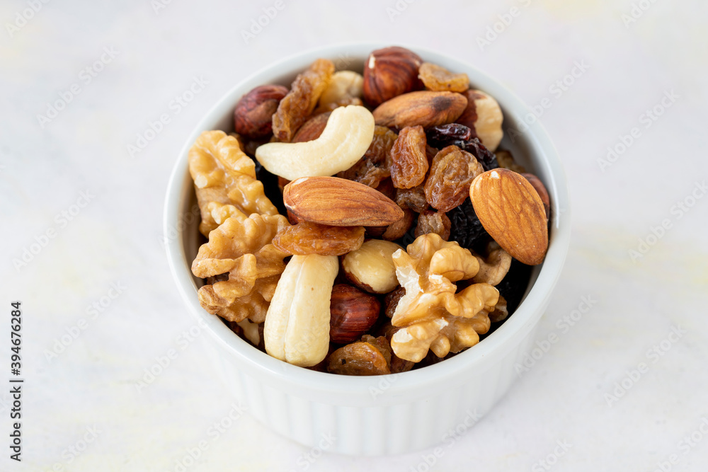 mixed nuts in bowl - on white background mixed nuts in bowl - on white background