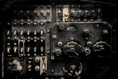 Interior of the old fashioned aircraft glider dashboard of World War II era military transport in black and white.