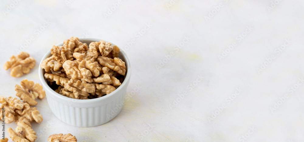 walnuts in bowl - on wooden background - copy space walnuts in bowl - on wooden background - copy space