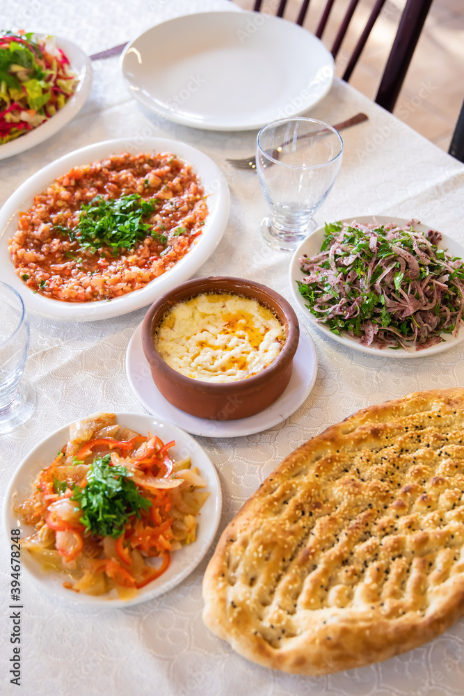 Traditional Turkish or middle eastern appetizer meze humus or hummus plate on the table in the restaurant