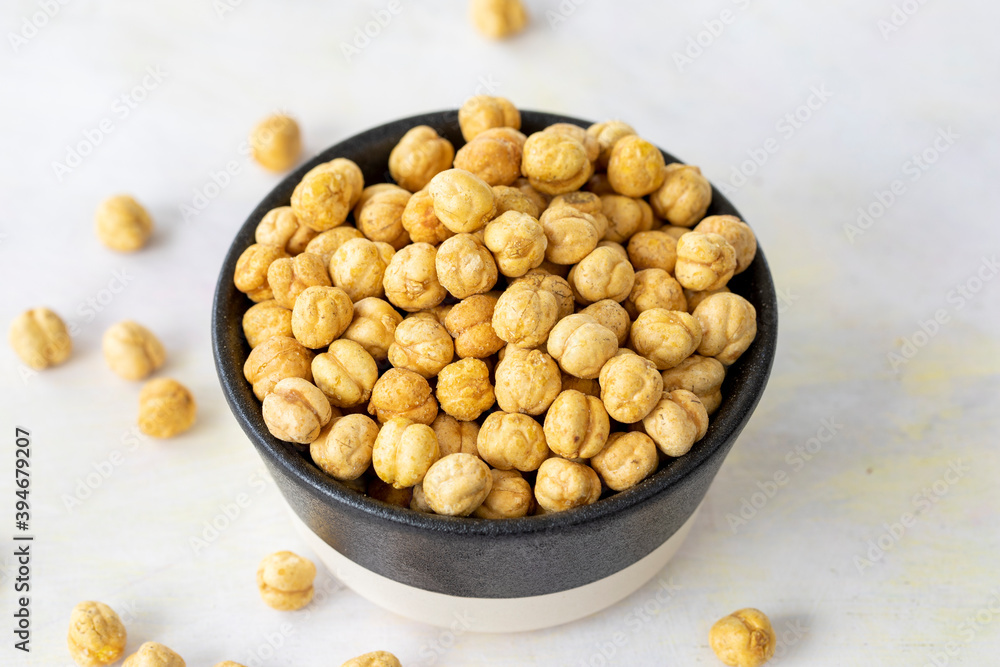 Hazelnuts in plate isolated on white background Hazelnuts in plate isolated on white background