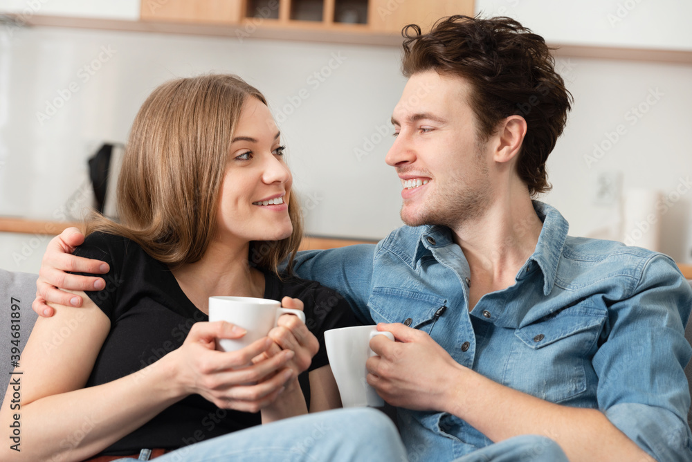 Smiling couple spend time together at home Smiling couple spend time together at home