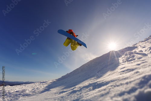 Snowboarder jumping against the sunset sky © aleksey ipatov