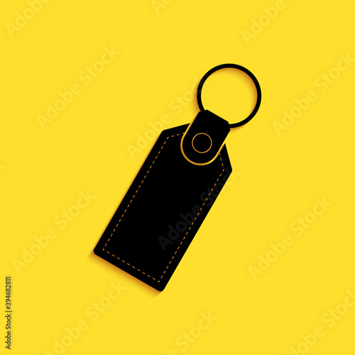 Black Rectangular key chain with ring for key icon isolated on yellow background. Long shadow style. Vector.