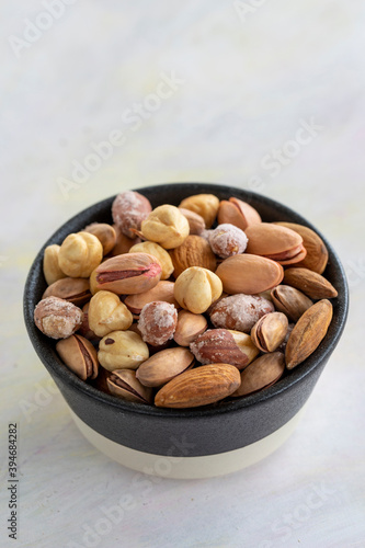mixed nuts in bowl - on white background