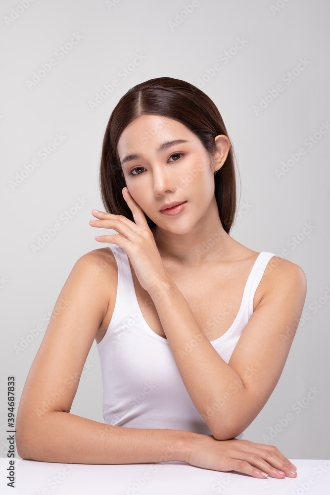 Beautiful Asian young woman touching soft cheek smile with clean and fresh skin Happiness and cheerful with positive emotional,isolated on gray background,Beauty and Cosmetics Concept Beautiful Asian young woman touching soft cheek smile with clean and fresh skin Happiness and cheerful with positive emotional,isolated on gray background,Beauty and Cosmetics Concept