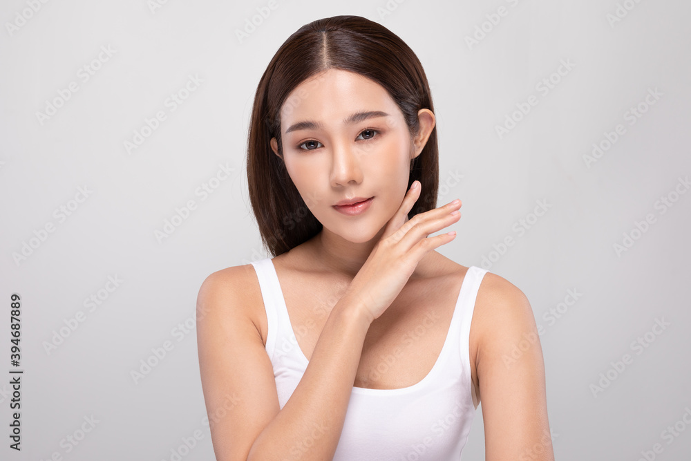Beautiful Asian young woman touching soft cheek smile with clean and fresh skin Happiness and cheerful with positive emotional,isolated on gray background,Beauty and Cosmetics Concept Beautiful Asian young woman touching soft cheek smile with clean and fresh skin Happiness and cheerful with positive emotional,isolated on gray background,Beauty and Cosmetics Concept