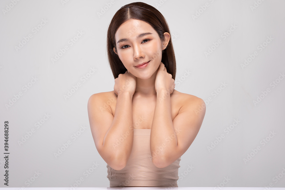 Beautiful Asian young woman holding hands smile with clean and fresh skin Happiness and cheerful with positive emotional,isolated on gray background,Beauty and Cosmetics Concept Beautiful Asian young woman holding hands smile with clean and fresh skin Happiness and cheerful with positive emotional,isolated on gray background,Beauty and Cosmetics Concept