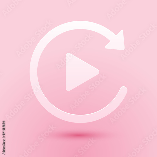 Paper cut Video play button like simple replay icon isolated on pink background. Paper art style. Vector.