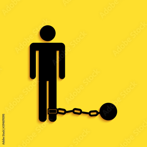 Black Prisoner with ball on chain icon isolated on yellow background. Long shadow style. Vector.