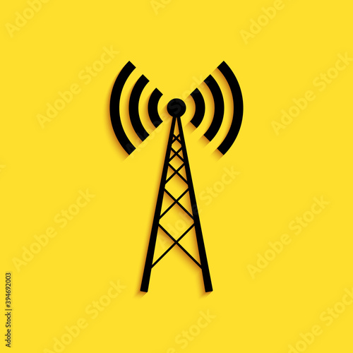 Black Antenna icon isolated on yellow background. Radio antenna wireless. Technology and network signal radio antenna. Long shadow style. Vector.