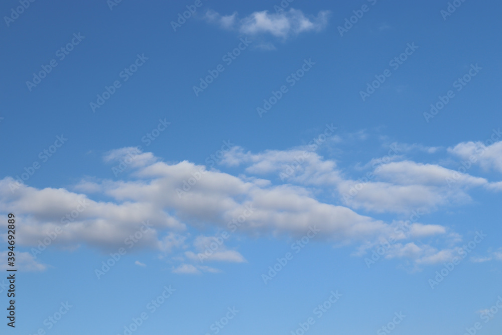 
white cloudy blue sky background