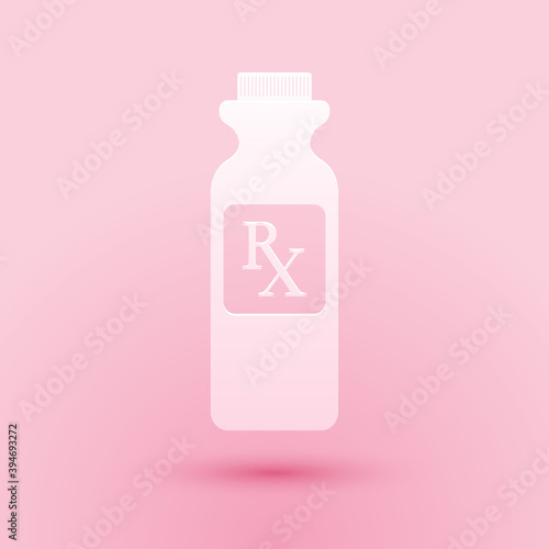 Paper cut Pill bottle with Rx sign and pills icon isolated on pink background. Pharmacy design. Rx as a prescription symbol on drug medicine bottle. Paper art style. Vector.