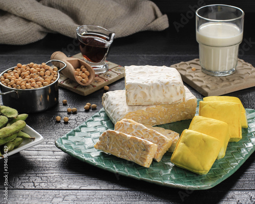 Soy Product: Raw Tofu, Tempeh, Soy Milk, Soy Sauce, and Soy Bean. Concept of Healthy Vegetarian Food photo