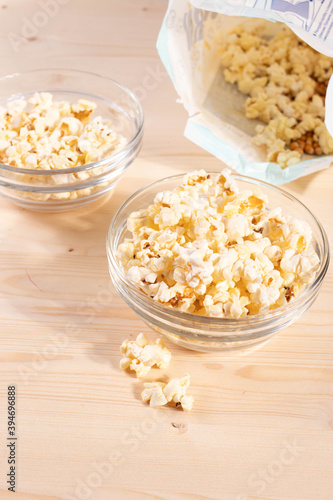 Wallpaper Mural crispy golden ready to eat popcorn in a glass bowl. close up shot.  Torontodigital.ca
