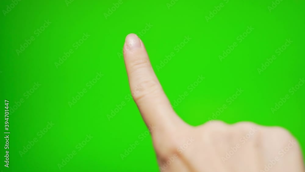 A Girl Erases or Draws with Her Finger on a Green Background, Green Screen, Alpha Channel, Chrome Key, Close-up of a Girl's Finger Isolated on a Green Background. A Girl Erases or Draws with Her Finger on a Green Background, Green Screen, Alpha Channel, Chrome Key, Close-up of a Girl's Finger Isolated on a Green Background.