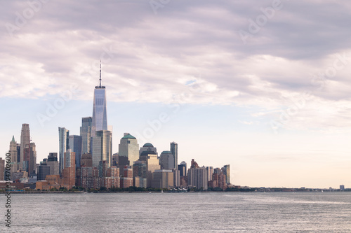 Lower Manhattan Skyline along the Hudson River in New York City with Beautiful Clouds © James