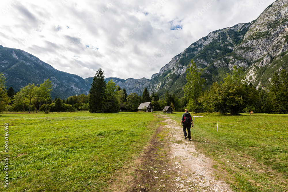 Hiking trip in the region of Ukanc near the Lake Bohinj in the Triglav National Park in Slovenia on summer day with clouds