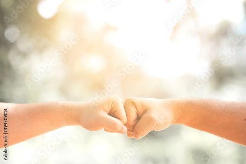concept health care and lifestyle,people fist bump at outdoor.