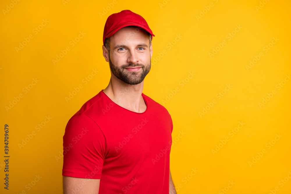 Photo of handsome bearded young guy look camera wait wear red t-shirt hat isolated yellow color background