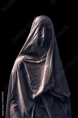 Canvas Print Portrait of a scary ghost isolated on black background