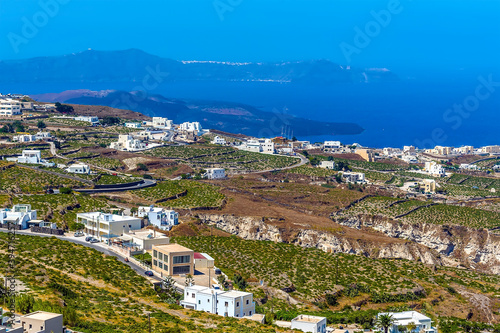 A view down from the castle ruins in Pyrgos, Santorini over the surrounding countryside in summertime