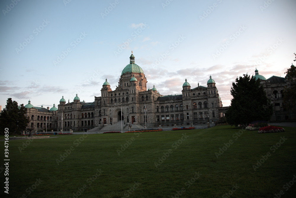 View of Parliament Building with garden and flowers under sunset in Victoria, Vancouver island, British Columbia, Canada