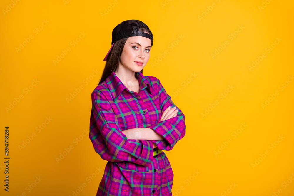 Photo of cheerful sweet brunette teen stand crossed hands wear pink dress cap isolated on bright yellow background Photo of cheerful sweet brunette teen stand crossed hands wear pink dress cap isolated on bright yellow background