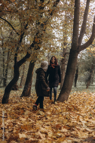 couple walking and play in autumn park