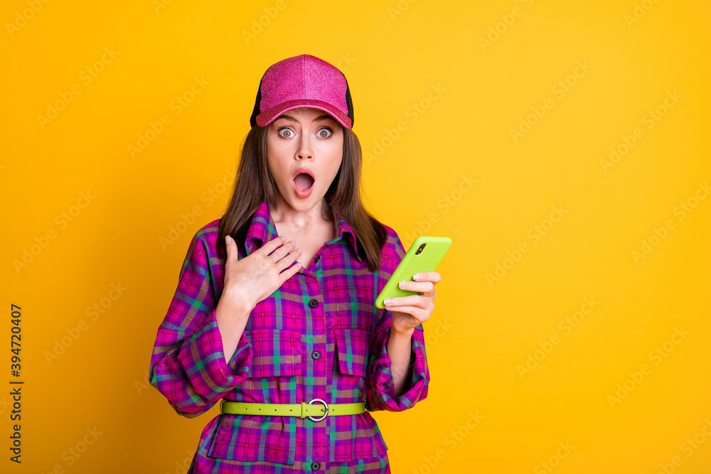 Portrait of attractive lady cant believe impressed open mouth violet hat isolated on yellow color background Portrait of attractive lady cant believe impressed open mouth violet hat isolated on yellow color background