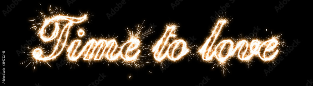 The inscription time to love on a black background with sparklers using a simulated long exposure The inscription time to love on a black background with sparklers using a simulated long exposure