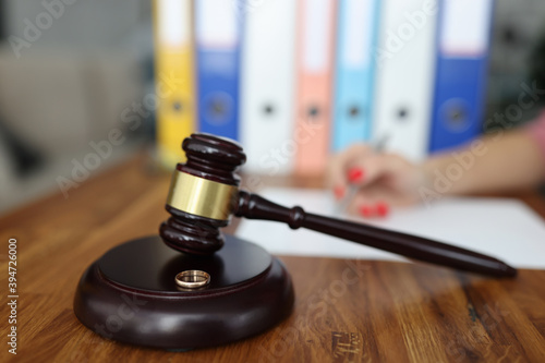 Photography Wooden gavel for judge on stand is a wedding ring