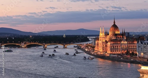 Dusk view to Parliament building and Danube river in Budapest, Hungary. photo