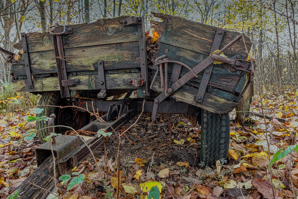 an aged dilapidated horse-drawn carriage an aged dilapidated horse-drawn carriage