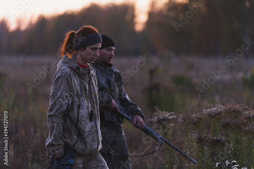 Obraz na plátně Hunters with guns go hunting