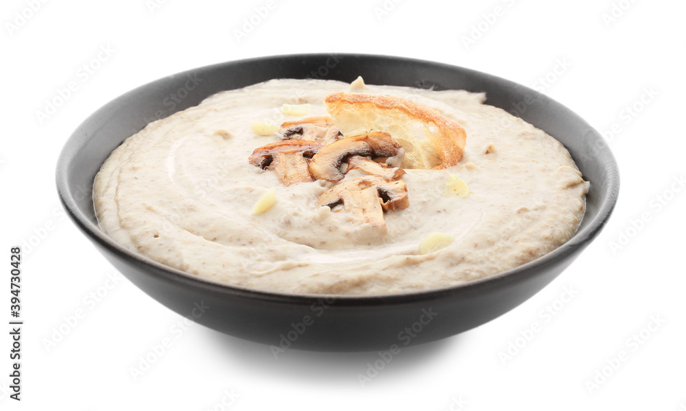 Plate of tasty mushroom cream soup on white background