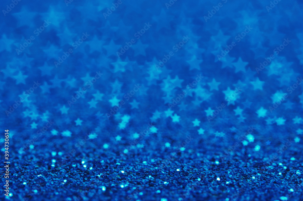 Blue holiday glitter background with stars bokeh. Blue holiday glitter background with stars bokeh.