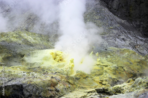 a smoking sulphur vent in a rocky volcanic landscape 