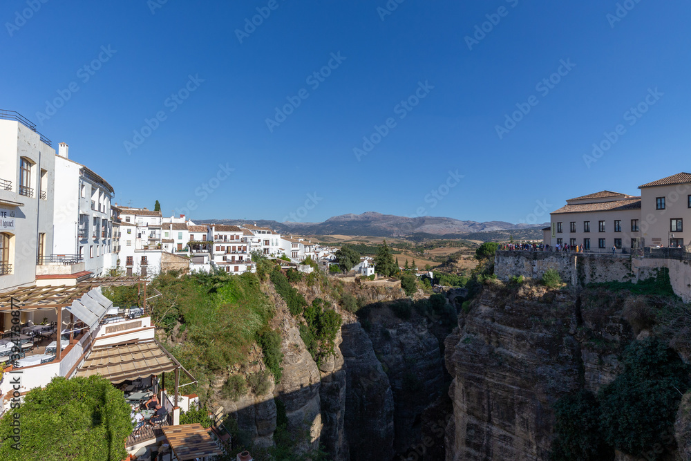 Obraz premium View into the gorge El Tajo in Ronda, one of the famous white towns of Andalusia, Spain.