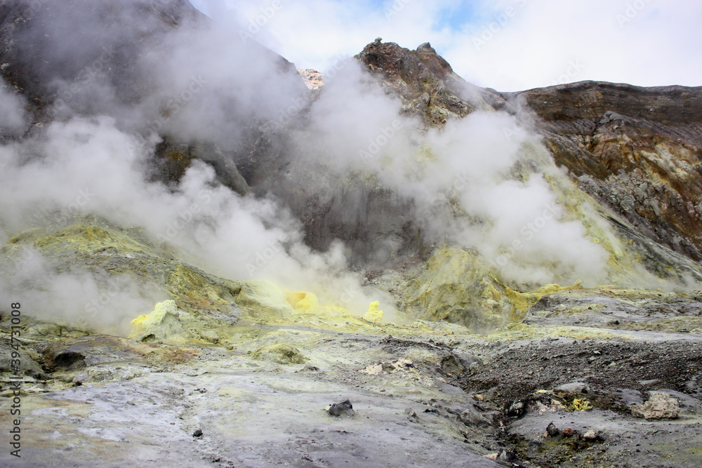 a smoking rocky volcano with steaming sulphur vents