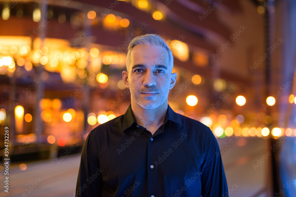 Portrait of attractive man at night on the streets Portrait of attractive man at night on the streets
