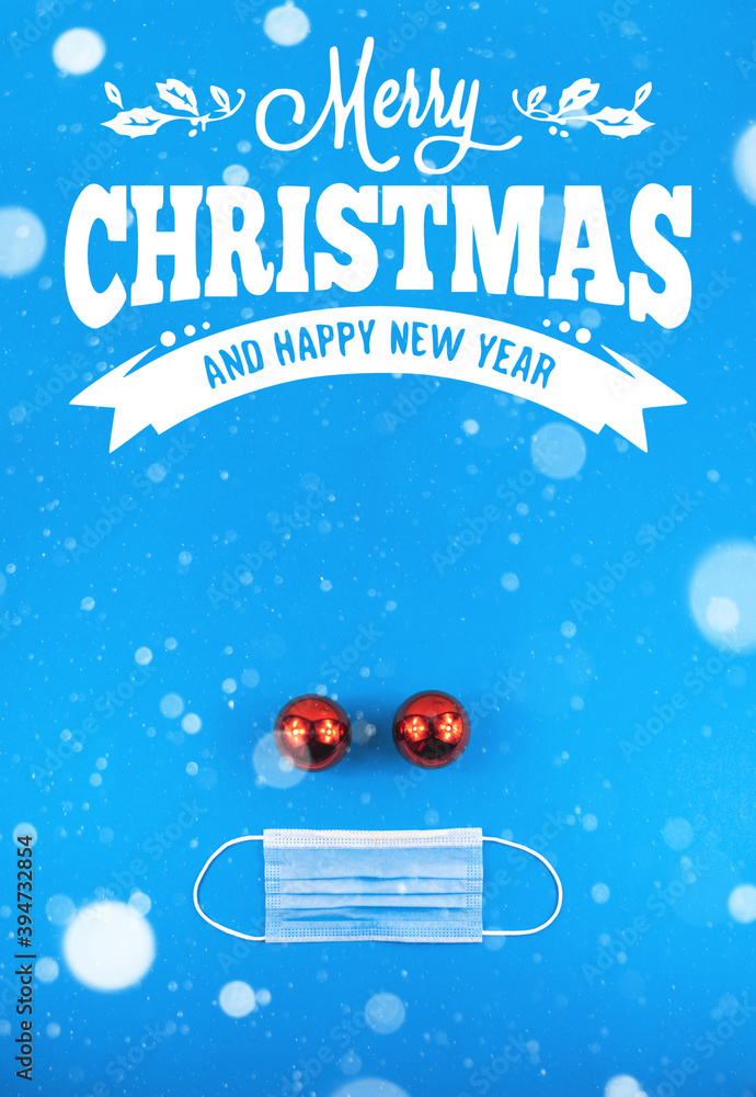 Wishes merry christmas on a blue background and with a protective mask, poster, template, layout, theme of COVID virus Wishes merry christmas on a blue background and with a protective mask, poster, template, layout, theme of COVID virus