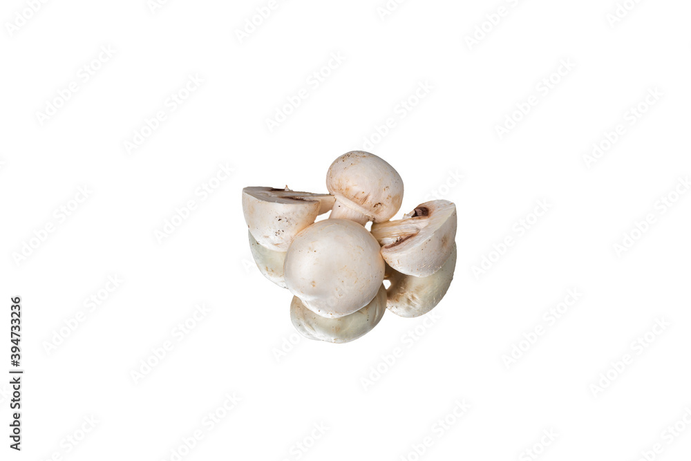 White champignon mushrooms are isolated on a white table. White champignon mushrooms are isolated on a white table.