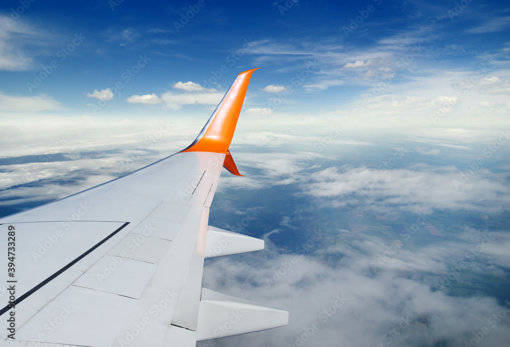 View from airplane window with blue sky View from airplane window with blue sky